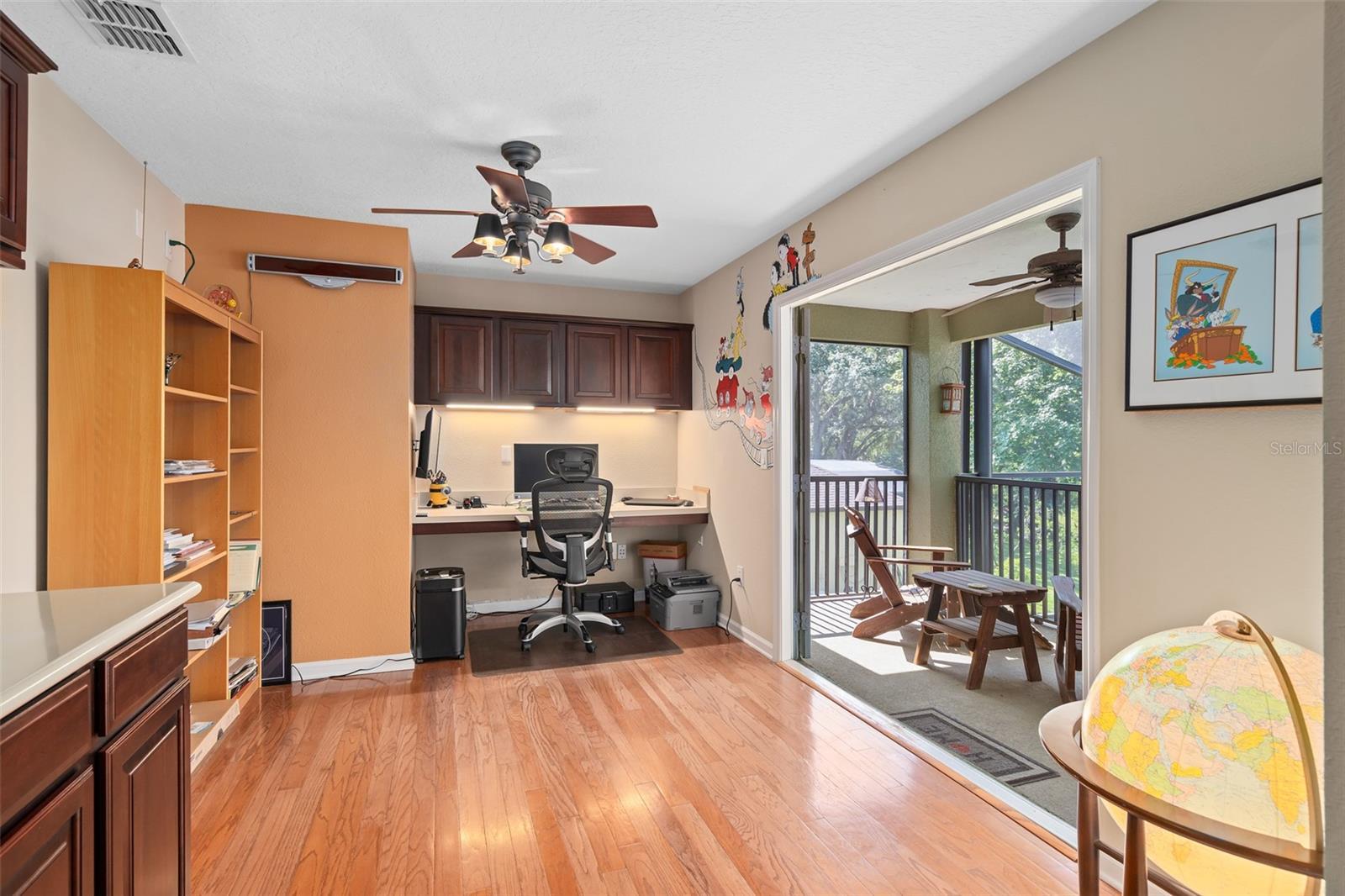 490 Wekiva Preserve Dr, Apopka, FL 32712 - office space with ceiling fan, light wood-style floors, built in study area, and baseboards