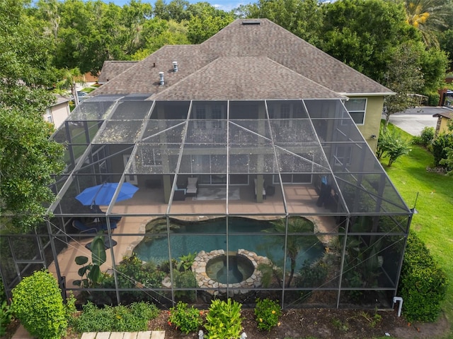 490 Wekiva Preserve Dr, Apopka, FL 32712 - back of house with a shingled roof, a patio, a lanai, and a pool with connected hot tub