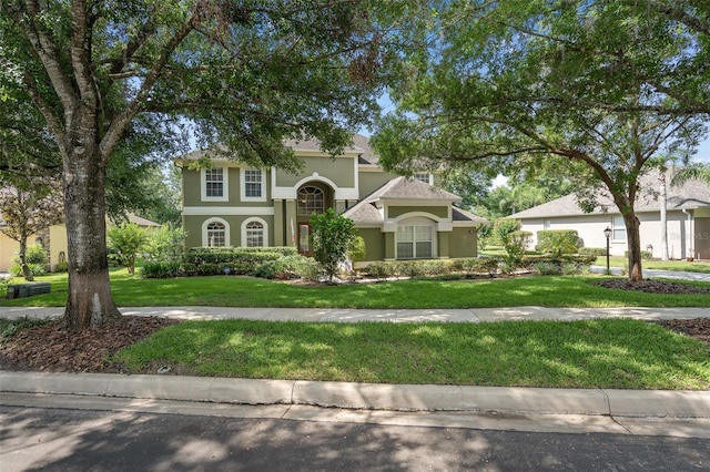 490 Wekiva Preserve Dr, Apopka, FL 32712 - view of front of home with stucco siding and a front lawn