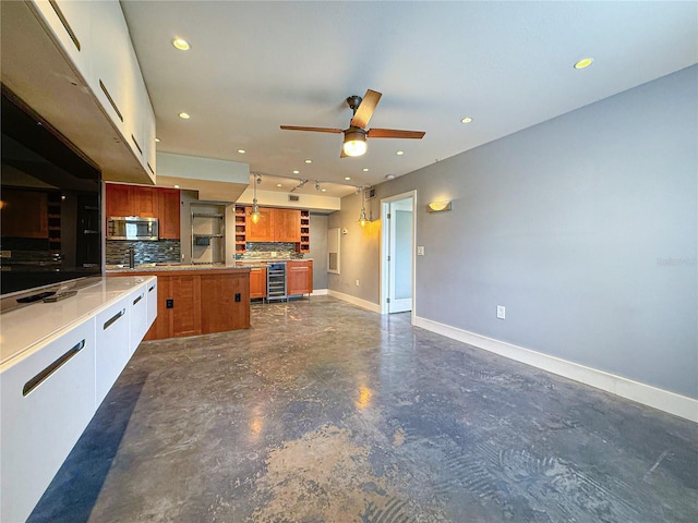 3034 Parkway Blvd Unit 102, Kissimmee, FL 34747 - kitchen with stainless steel microwave, tasteful backsplash, a ceiling fan, baseboards, and recessed lighting