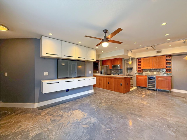3034 Parkway Blvd Unit 102, Kissimmee, FL 34747 - kitchen with wine cooler, open shelves, baseboards, stainless steel appliances, and a ceiling fan