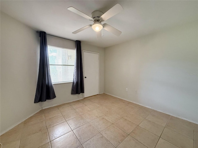 3034 Parkway Blvd Unit 102, Kissimmee, FL 34747 - unfurnished room featuring light tile patterned floors, ceiling fan, and baseboards