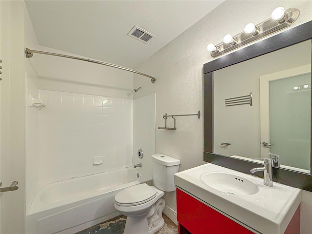 3034 Parkway Blvd Unit 102, Kissimmee, FL 34747 - bathroom featuring a textured wall, vanity, toilet, and bathtub / shower combination