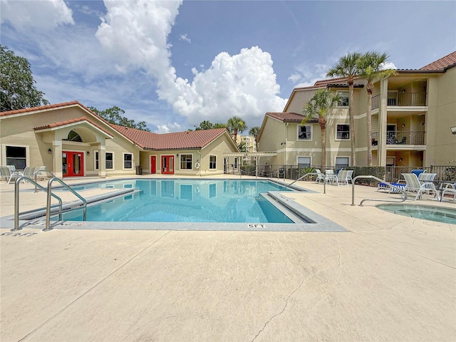 3034 Parkway Blvd Unit 102, Kissimmee, FL 34747 - community pool with french doors and a patio
