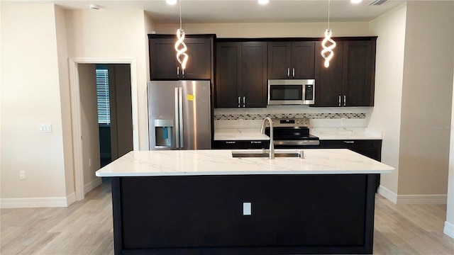 3269 Ponce De Leon Blvd, North Port, FL 34291 - kitchen with stainless steel appliances, a sink, tasteful backsplash, light wood-style floors, and recessed lighting