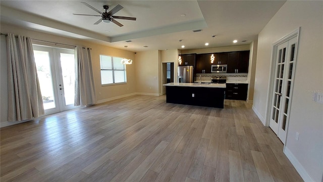 3269 Ponce De Leon Blvd, North Port, FL 34291 - kitchen with french doors, appliances with stainless steel finishes, open floor plan, a sink, and recessed lighting
