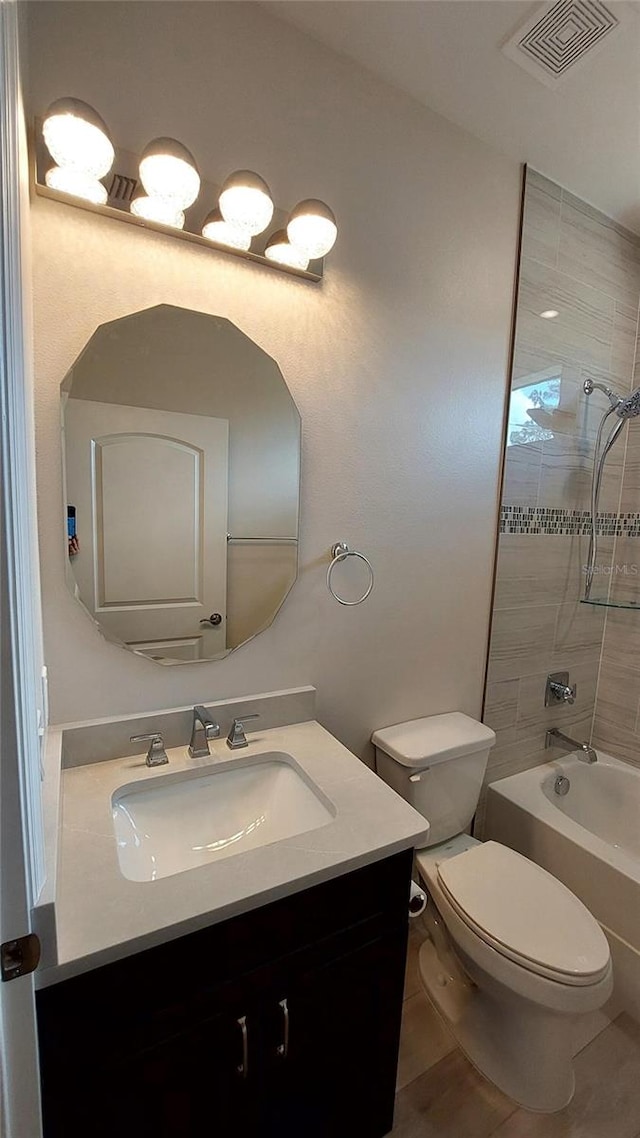 3269 Ponce De Leon Blvd, North Port, FL 34291 - bathroom with vanity, toilet, washtub / shower combination, and tile patterned flooring