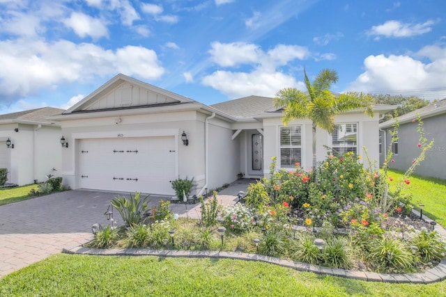 1425 Lone Wood Blvd, Orlando, FL 32828 - ranch-style house with a garage, decorative driveway, and stucco siding