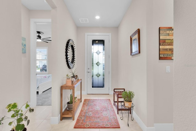 1425 Lone Wood Blvd, Orlando, FL 32828 - entrance foyer with baseboards, light tile patterned floors, and ceiling fan