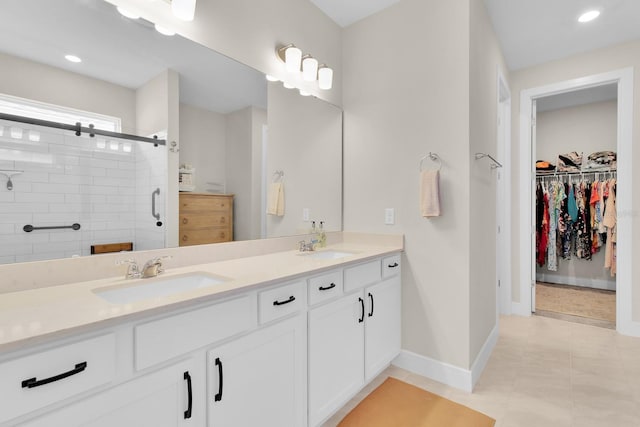 1425 Lone Wood Blvd, Orlando, FL 32828 - full bath featuring double vanity, a shower stall, a spacious closet, baseboards, and recessed lighting