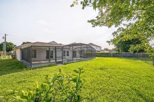 657 Mckinley Ct, Kissimmee, FL 34758 - view of yard featuring glass enclosure and a patio