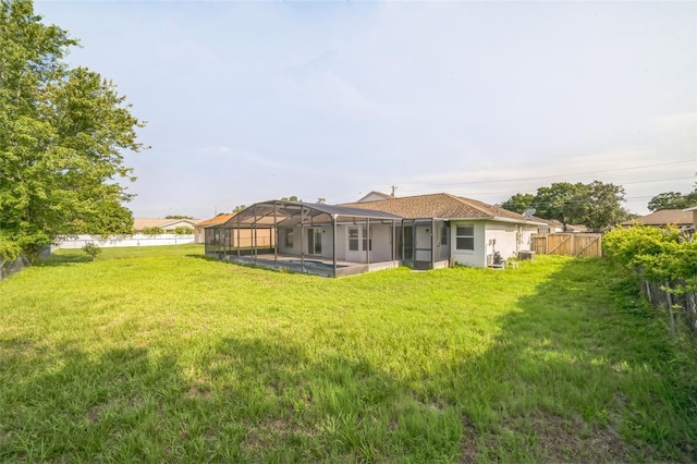 657 Mckinley Ct, Kissimmee, FL 34758 - back of house featuring a lanai and stucco siding