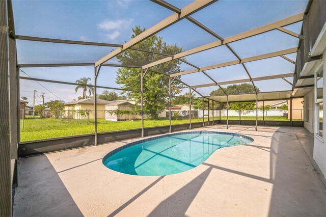 657 Mckinley Ct, Kissimmee, FL 34758 - view of swimming pool featuring a patio and glass enclosure