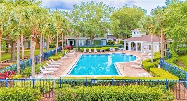725 Ashworth Overlook Dr Unit C, Apopka, FL 32712 - community pool with a patio area and view of wooded area