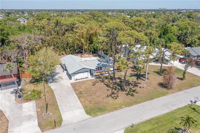 view from above of property featuring a heavily wooded area