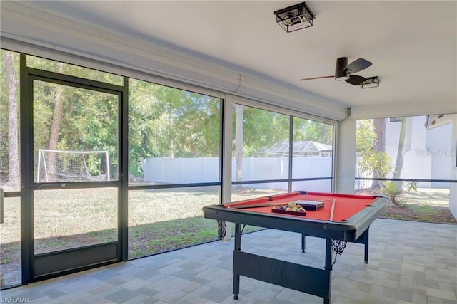 sunroom / solarium featuring ceiling fan and billiards table