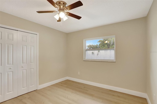 2835 Bongart Rd, Winter Park, FL 32792 - unfurnished bedroom featuring light wood-style floors, baseboards, a closet, and a ceiling fan