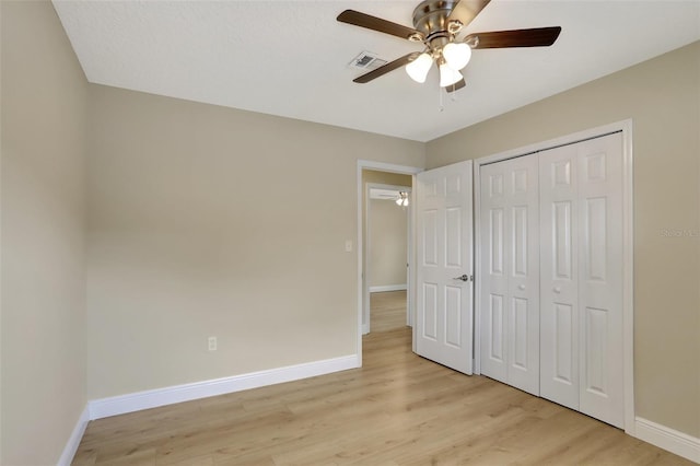 2835 Bongart Rd, Winter Park, FL 32792 - unfurnished bedroom with baseboards, light wood finished floors, a closet, and a ceiling fan