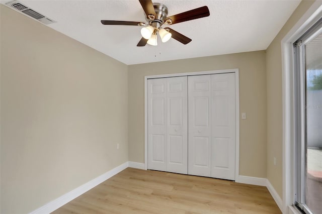 2835 Bongart Rd, Winter Park, FL 32792 - unfurnished bedroom with light wood-type flooring, baseboards, a ceiling fan, and a closet