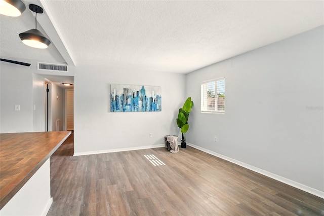320 Lakeview St Unit 220, Orlando, FL 32804 - unfurnished room with a textured ceiling, wood finished floors, and baseboards