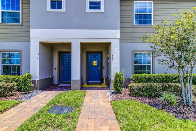 322 Annabelle Way, Davenport, FL 33837 - doorway to property with stucco siding