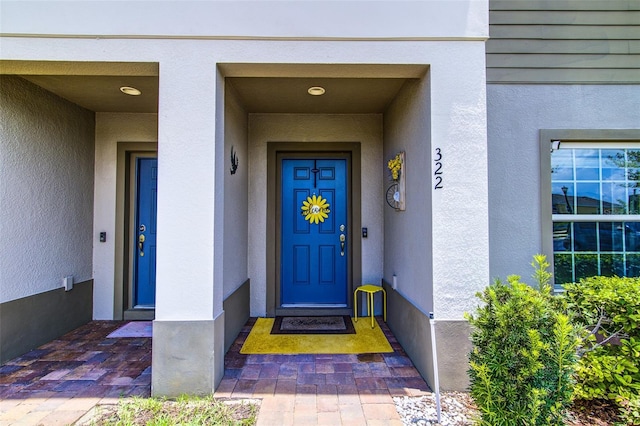 322 Annabelle Way, Davenport, FL 33837 - doorway to property featuring stucco siding