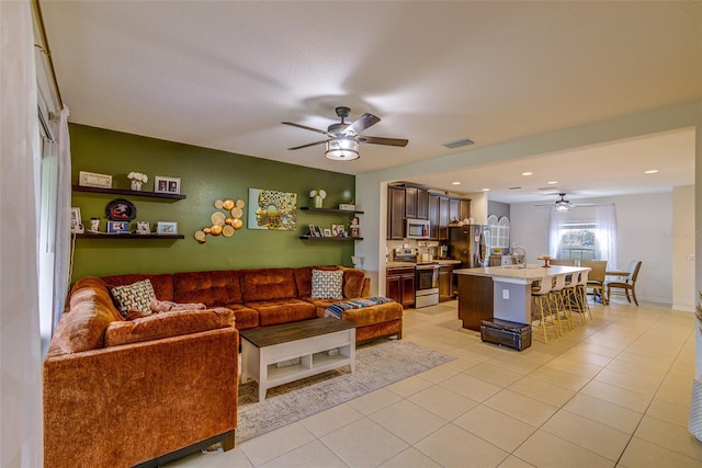 322 Annabelle Way, Davenport, FL 33837 - living area with ceiling fan, light tile patterned floors, and recessed lighting