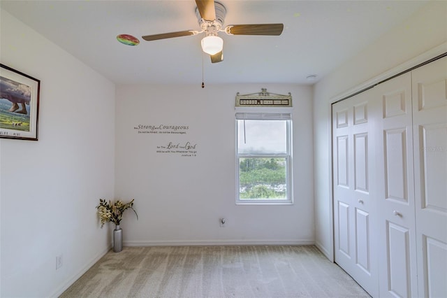 322 Annabelle Way, Davenport, FL 33837 - unfurnished bedroom with light carpet, a closet, and ceiling fan