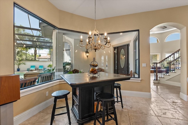 1010 Juliette Blvd, Mount Dora, FL 32757 - dining area featuring healthy amount of natural light, stairs, a chandelier, and arched walkways