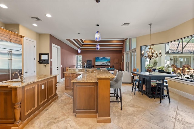 1010 Juliette Blvd, Mount Dora, FL 32757 - kitchen featuring a large island, stainless steel built in refrigerator, open floor plan, a sink, and plenty of natural light