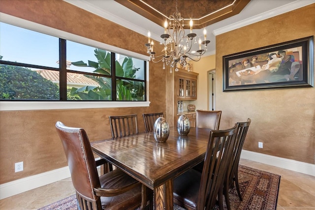 1010 Juliette Blvd, Mount Dora, FL 32757 - dining area with plenty of natural light, a chandelier, baseboards, ornamental molding, and a raised ceiling