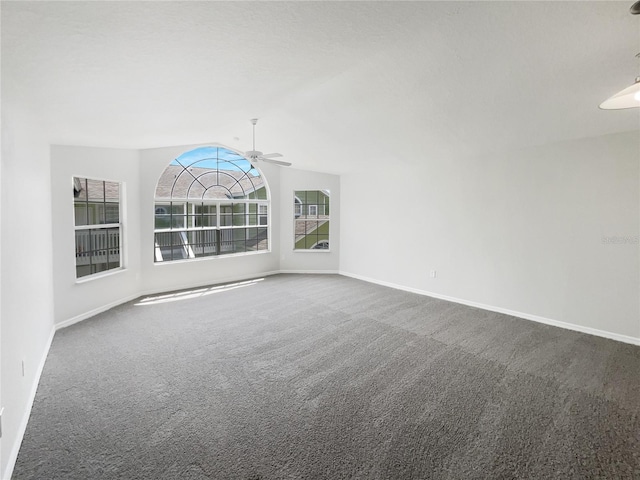 3142 Britannia Blvd Unit C, Kissimmee, FL 34747 - spare room with carpet flooring, ceiling fan, baseboards, and vaulted ceiling