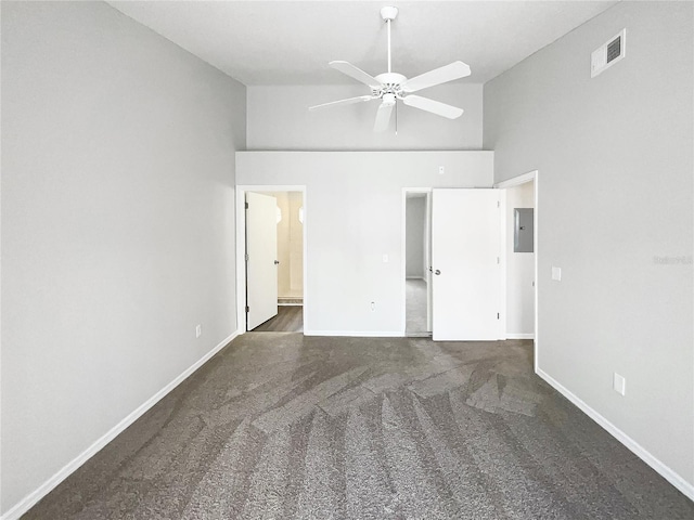 3142 Britannia Blvd Unit C, Kissimmee, FL 34747 - unfurnished bedroom with high vaulted ceiling, electric panel, carpet floors, baseboards, and ensuite bathroom