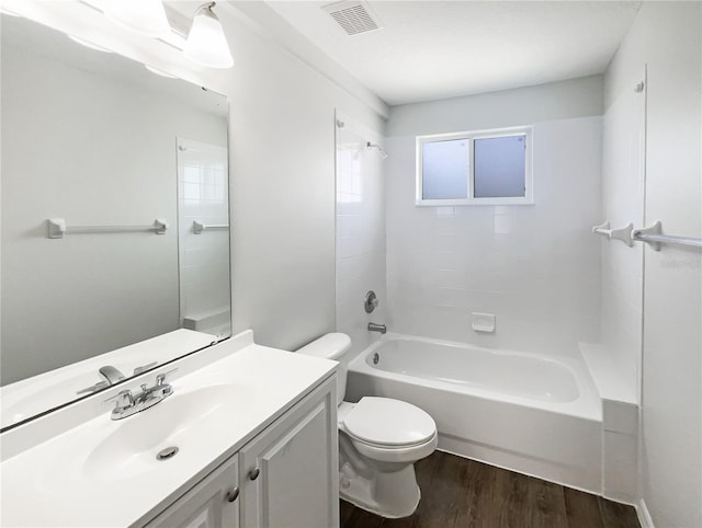3142 Britannia Blvd Unit C, Kissimmee, FL 34747 - full bath with wood finished floors, toilet, vanity, and washtub / shower combination