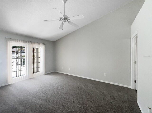 3142 Britannia Blvd Unit C, Kissimmee, FL 34747 - spare room featuring vaulted ceiling, dark colored carpet, baseboards, and a ceiling fan
