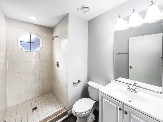 3142 Britannia Blvd Unit C, Kissimmee, FL 34747 - bathroom with tiled shower, toilet, and vanity