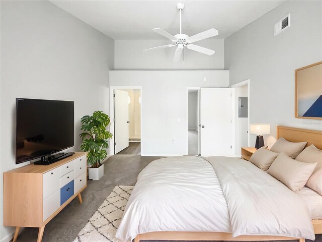 3142 Britannia Blvd Unit C, Kissimmee, FL 34747 - carpeted bedroom featuring high vaulted ceiling, electric panel, ensuite bath, and a ceiling fan