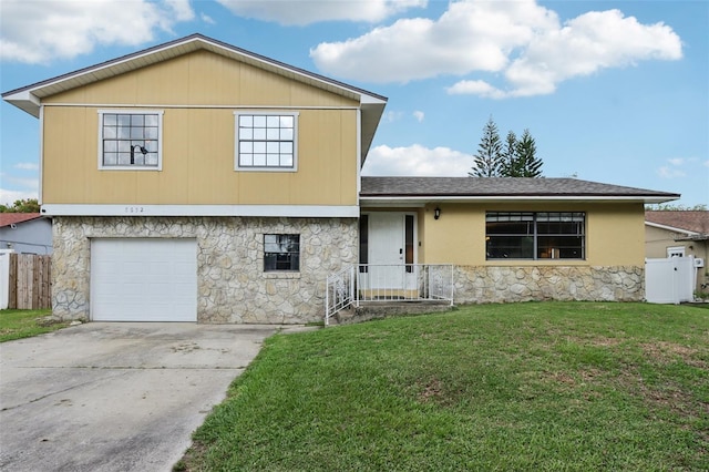 8652 Savory Dr, Orlando, FL 32825 - split level home with stone siding, a garage, driveway, and roof with shingles