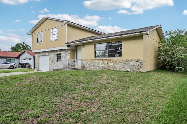 8652 Savory Dr, Orlando, FL 32825 - tri-level home featuring stone siding, driveway, a front yard, and a garage