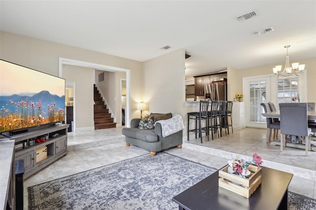 8652 Savory Dr, Orlando, FL 32825 - living area featuring a chandelier and stairs