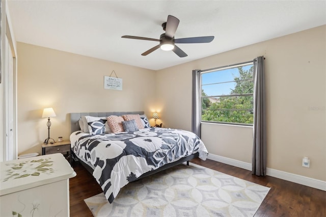 8652 Savory Dr, Orlando, FL 32825 - bedroom with wood finished floors, baseboards, and ceiling fan