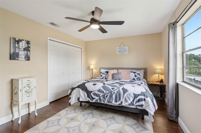 8652 Savory Dr, Orlando, FL 32825 - bedroom with wood finished floors, a closet, baseboards, and ceiling fan