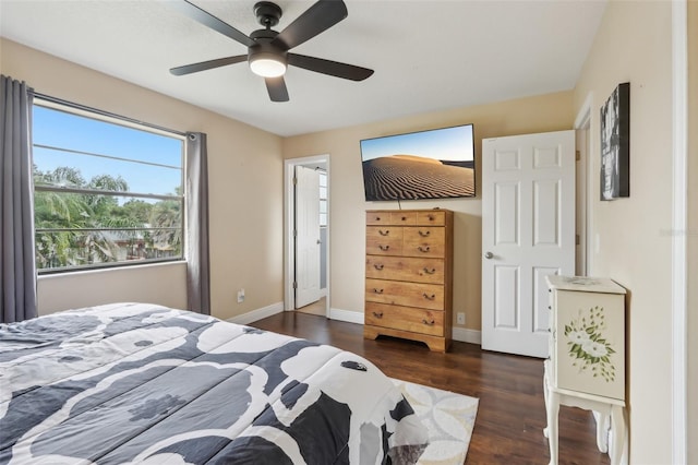 8652 Savory Dr, Orlando, FL 32825 - bedroom featuring dark wood finished floors, baseboards, and a ceiling fan