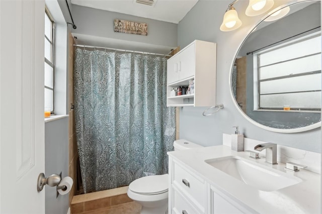 8652 Savory Dr, Orlando, FL 32825 - bathroom with toilet, vanity, tile patterned floors, and a shower with shower curtain