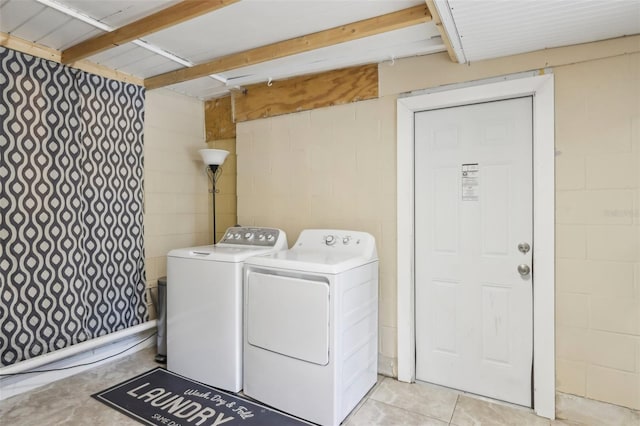 8652 Savory Dr, Orlando, FL 32825 - laundry area with concrete block wall and independent washer and dryer