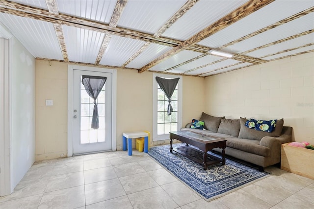 8652 Savory Dr, Orlando, FL 32825 - living room with concrete block wall and light tile patterned flooring