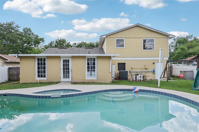 8652 Savory Dr, Orlando, FL 32825 - view of swimming pool featuring an in-ground hot tub and cooling unit