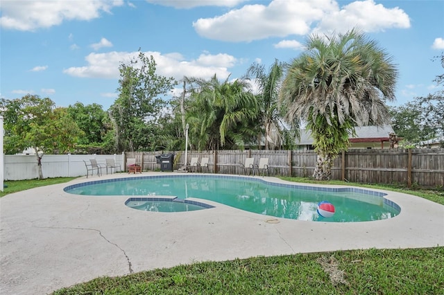8652 Savory Dr, Orlando, FL 32825 - view of pool featuring a fenced backyard, a patio, and a pool with connected hot tub
