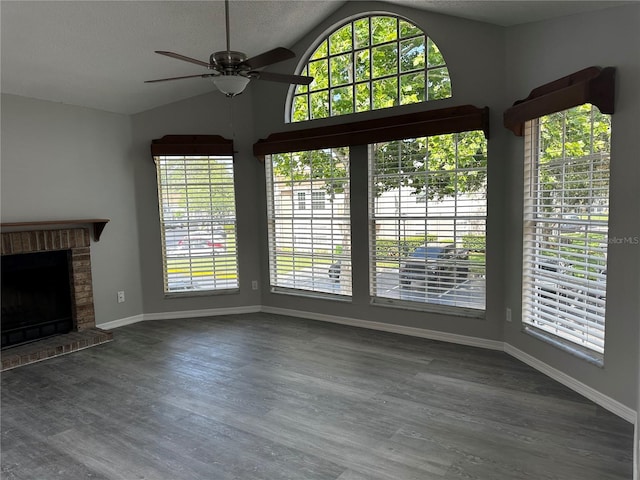 652 Roaring Dr Unit 234, Altamonte Springs, FL 32714 - unfurnished living room featuring healthy amount of natural light, ceiling fan, lofted ceiling, baseboards, and wood finished floors
