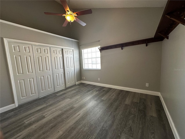 652 Roaring Dr Unit 234, Altamonte Springs, FL 32714 - unfurnished bedroom with baseboards, dark wood-style floors, a closet, ceiling fan, and high vaulted ceiling